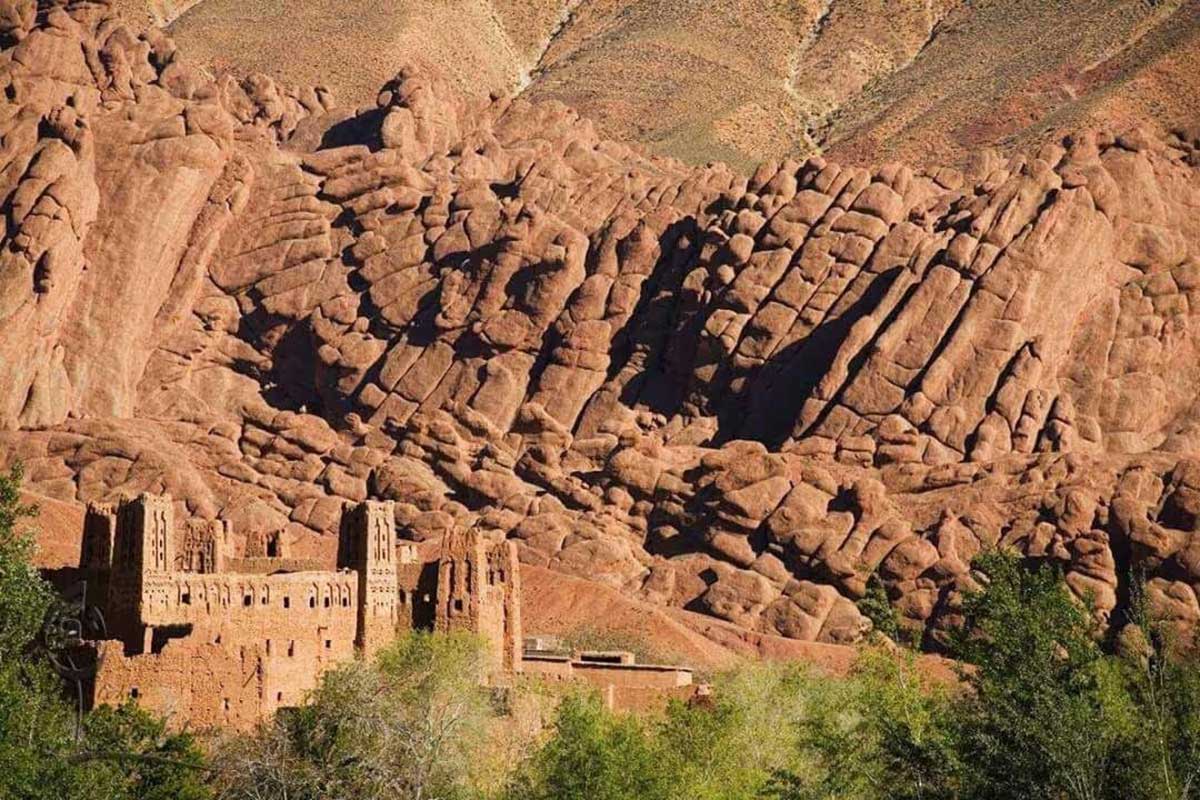 The curious "Monkey Fingers" rock formations towering over a kasbah in the Dades Valley.